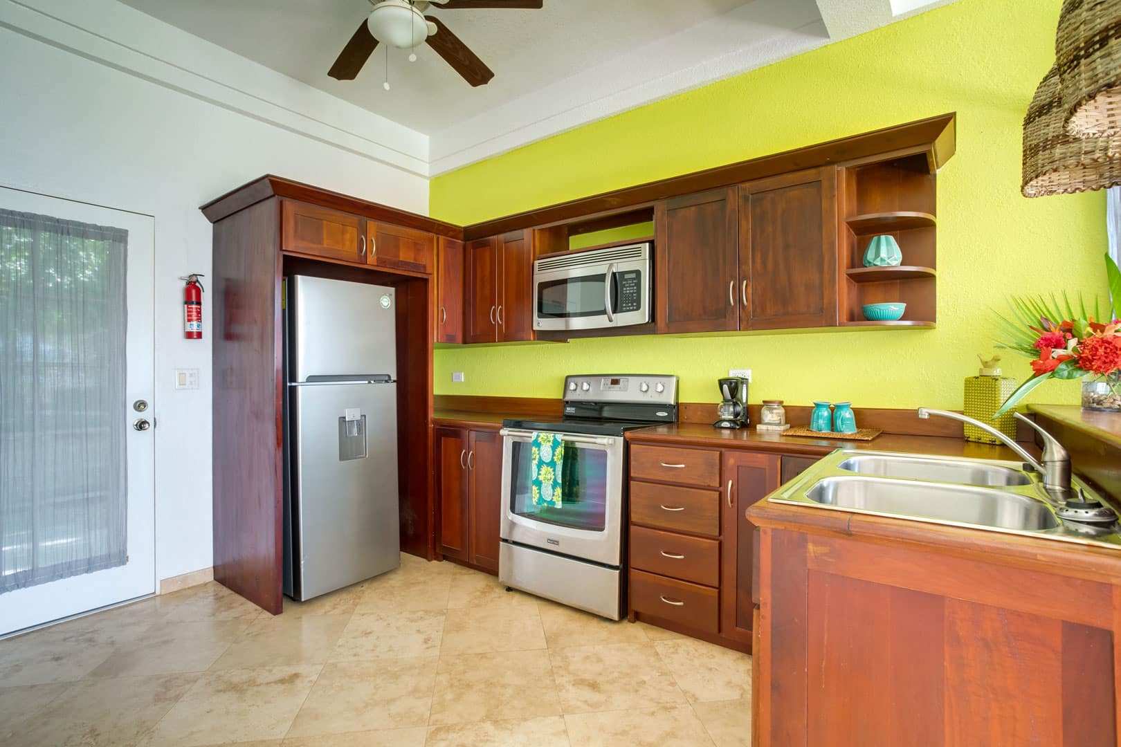 The kitchen inside the 1 Bedroom Lagoon Bayview at Umaya Resort & Adventure