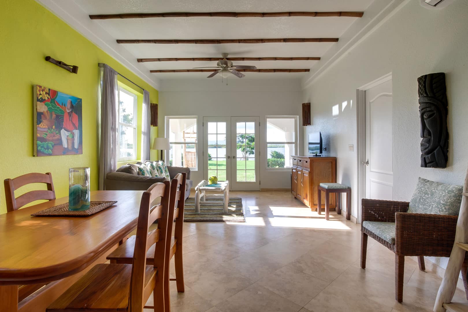 View from the dining area into the living room area inside the 1 Bedroom Lagoon Bayview at Umaya Resort & Adventure