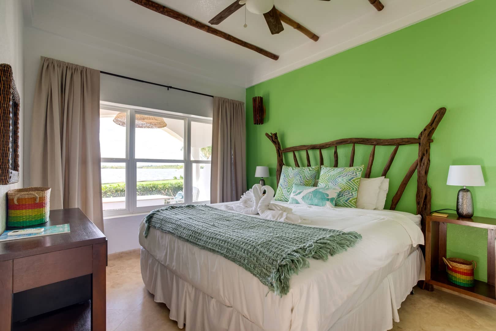 The master bedroom with a king sized bed inside the 1 Bedroom Lagoon Bayview at Umaya Resort & Adventure