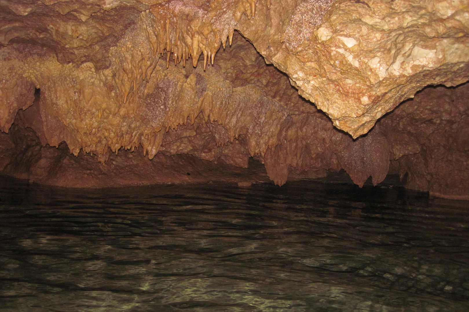 Cave wall with small stalactites inside the Actun Tunichil Muknal (ATM Cave) at The Rainforest Lodge at Sleeping Giant Resort