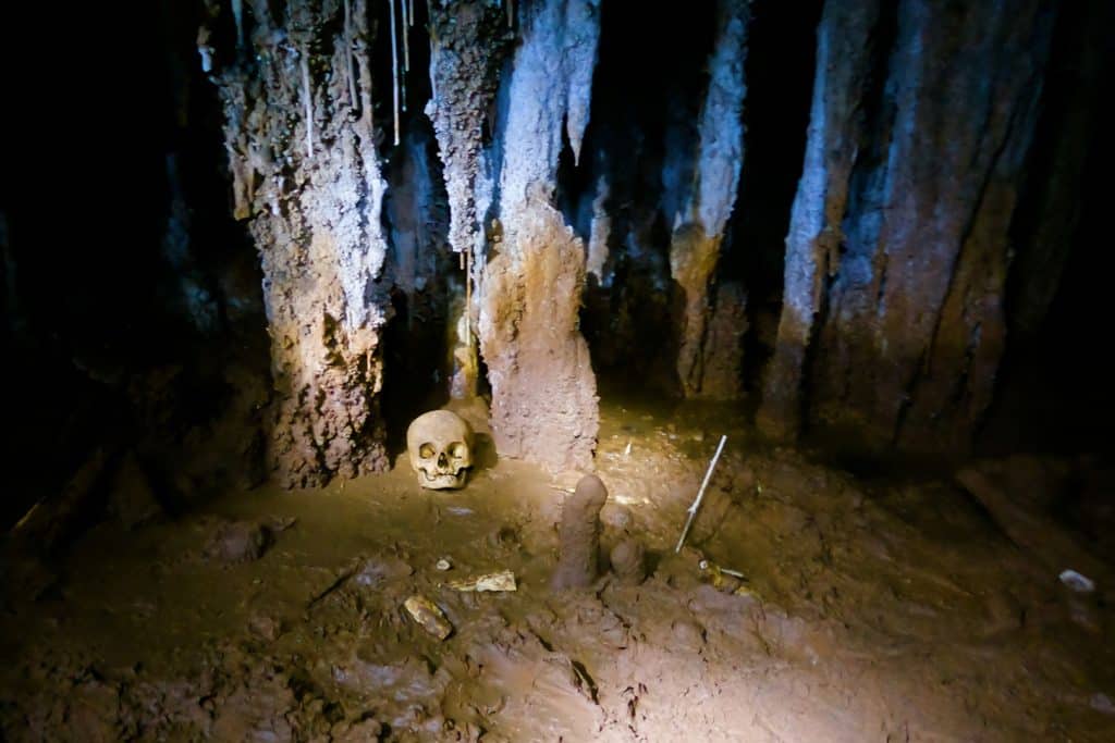 Skeletal remains and pieces of pottery inside the Ceremonial Cave at The Rainforest Lodge at Sleeping Giant Resort