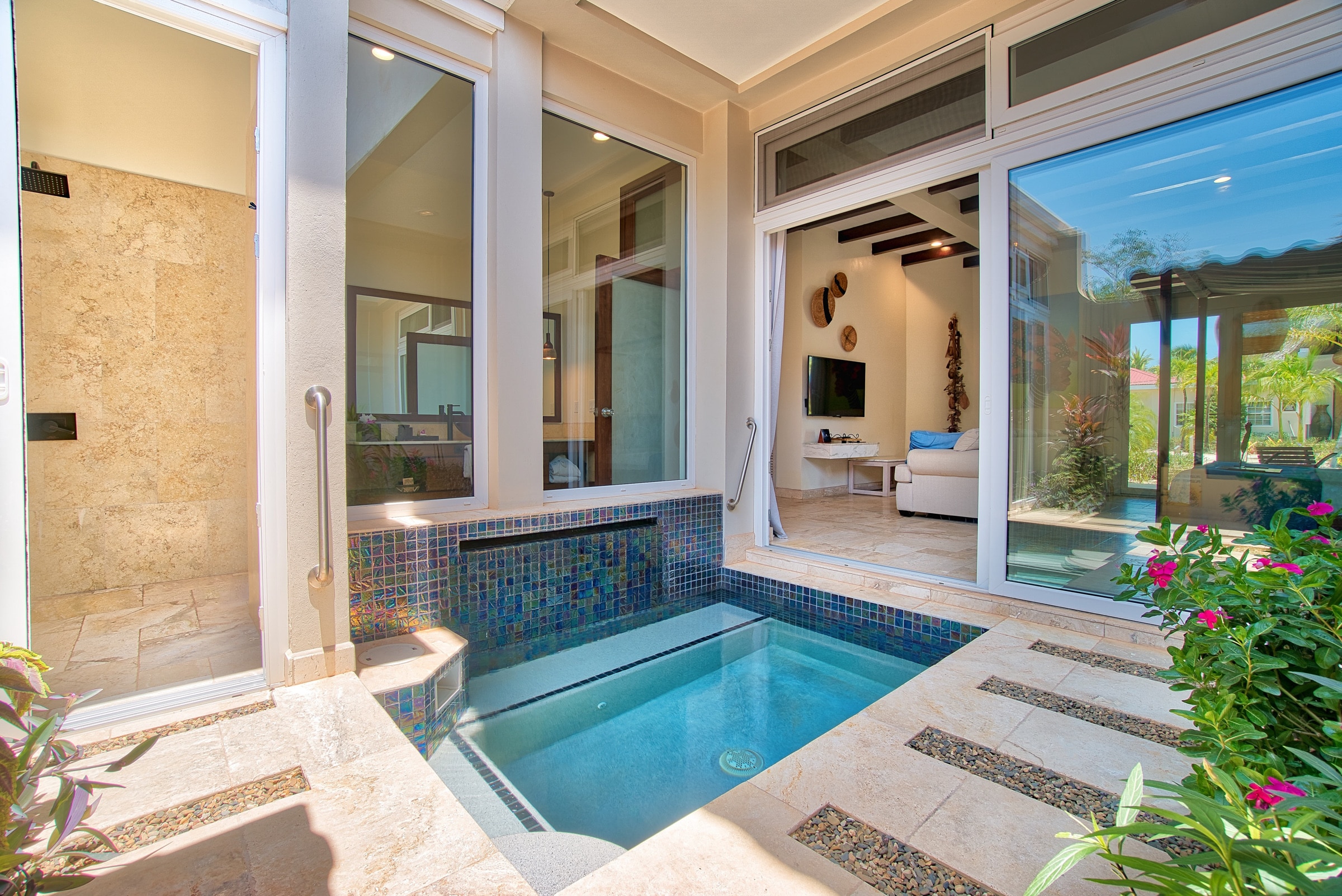 Outdoor patio with plunge pool and shower for the Deluxe Suite Lower Level with Plunge Pool at The Lodge at Jaguar Reef Resort